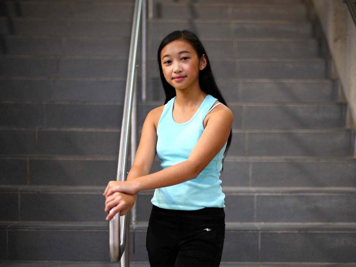 Aliyah posing on the steps of University Centre at the University of Manitoba