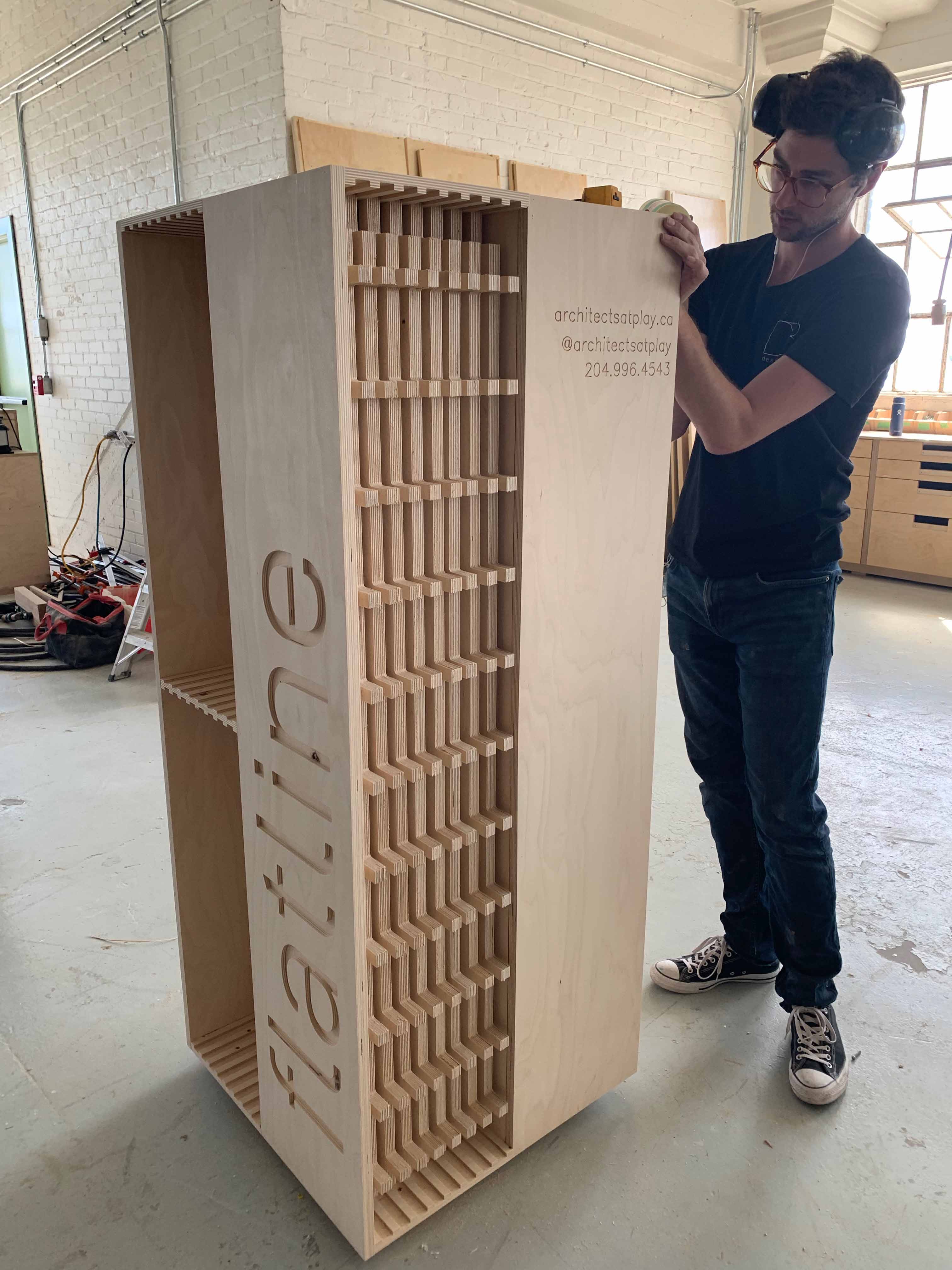 Test fitting the panels in the cabinet at the Design-Built shop