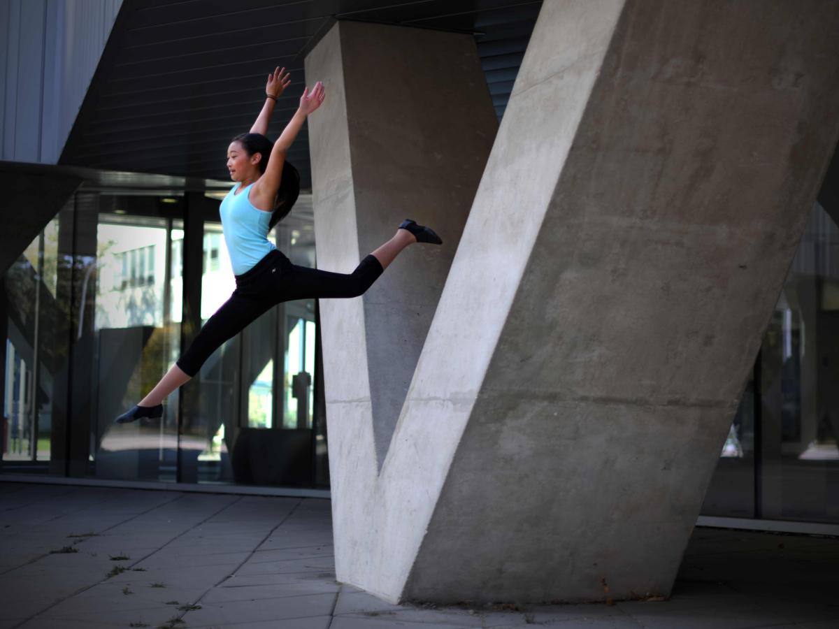 Aliyah jumping off the V-shaped columns at the University of Manitoba