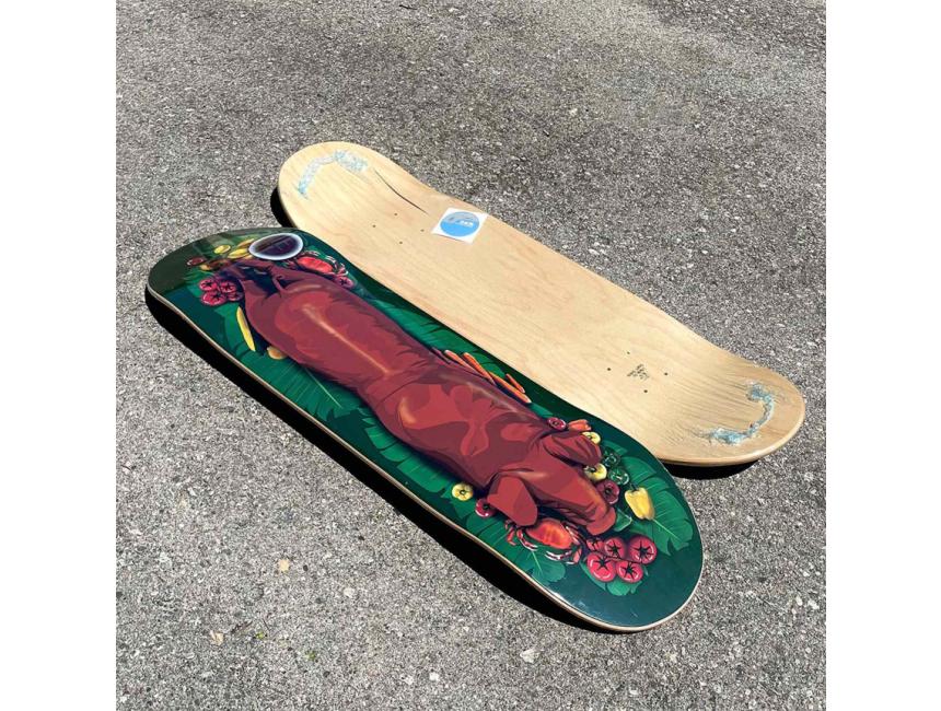 Lechon Skateboard Deck on Concrete
