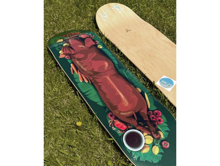 Lechon Skateboard Deck on Grass